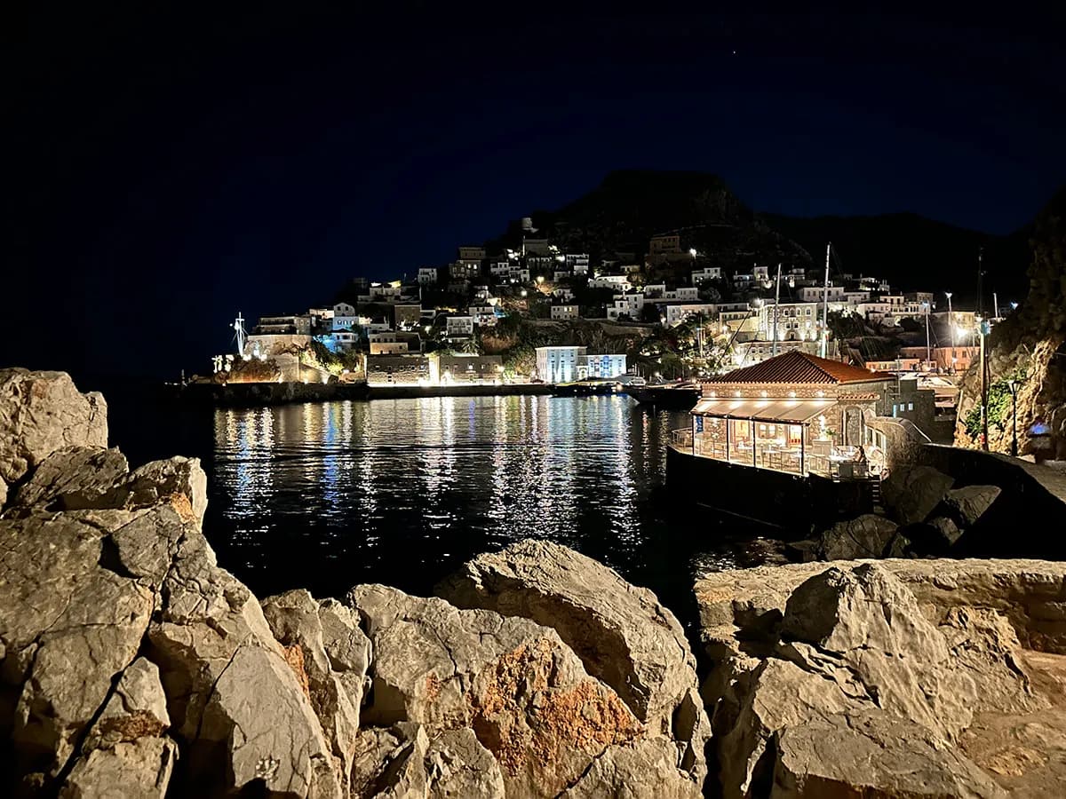 Peaceful Greek island harbor at night